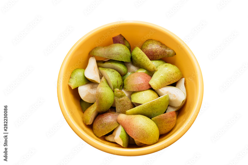 sliced pears in a yellow bowl on a white background, isolate sliced pears in a yellow bowl on a white background, isolate