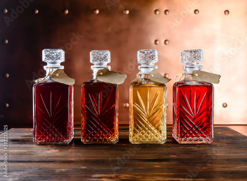 Aromatic wines, liqueurs, tincture and spirits in elegant bottles, still life