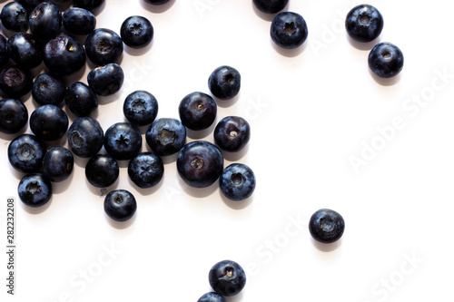 Blueberry on white background top view with copy space.