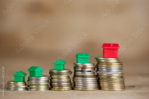 House Models On Stacked Coins Finance Concept