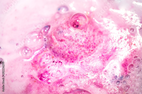 The bright bath bomb dissolves in water .