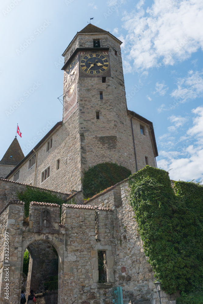 view of the medieval castle and clock tower in Rapperswil