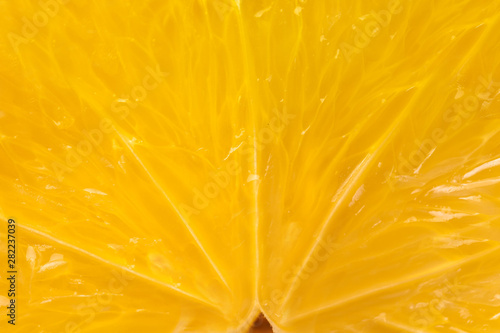 Heart of orange fruit extra close-up in a cut.