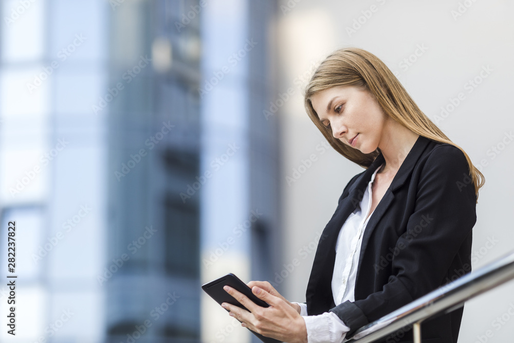 Beautiful woman checking her tablet Beautiful woman checking her tablet