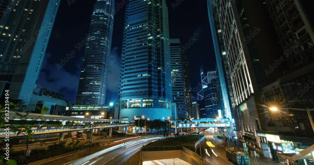 Cityscape timelapse at night busy traffic In downtown. Very busy road in the central district in rush hour Cityscape timelapse at night busy traffic In downtown. Very busy road in the central district in rush hour