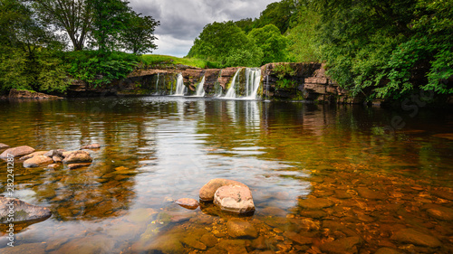 Wain Wath Force on the River Swale, is a waterfall situated on the River Swale in the Yorkshire Dales National Park and flows beneath the limestone cliffs of Cotterby Scar photo