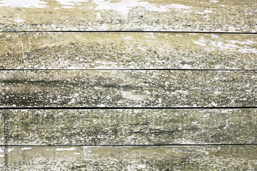 Old  weathered wooden wall. Peeling paint plank texture. Floor made with desks  dirty and grunge board background.