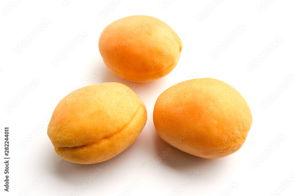 Isolated apricots. Fresh whole apricot fruit with leaf and half isolated on white background with clipping path Isolated apricots. Fresh whole apricot fruit with leaf and half isolated on white background with clipping path