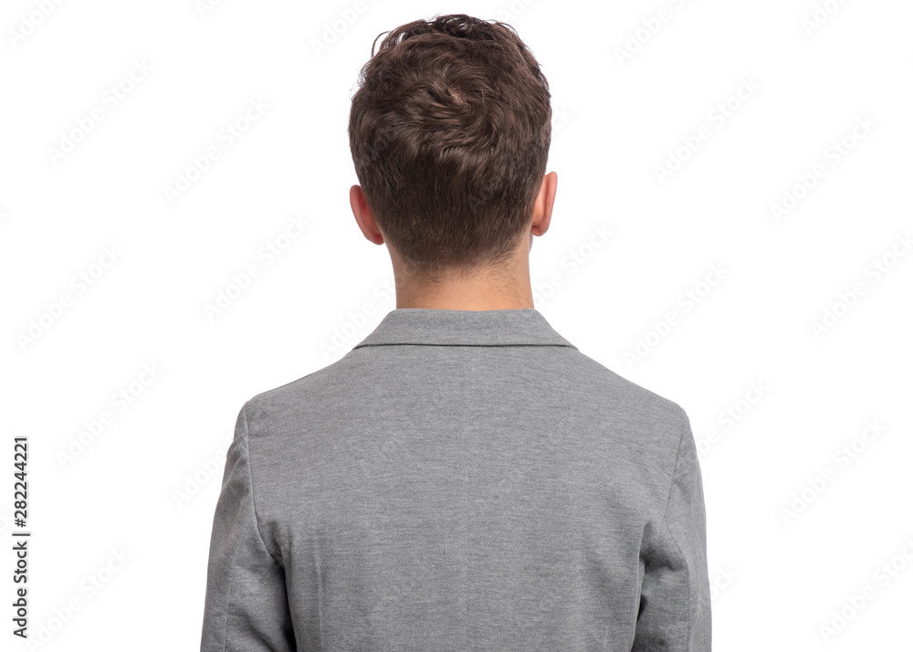 Portrait of young caucasian teen boy - rear view, isolated on white background. Funny teenager - back view. Handsome child in gray suit. Portrait of young caucasian teen boy - rear view, isolated on white background. Funny teenager - back view. Handsome child in gray suit.