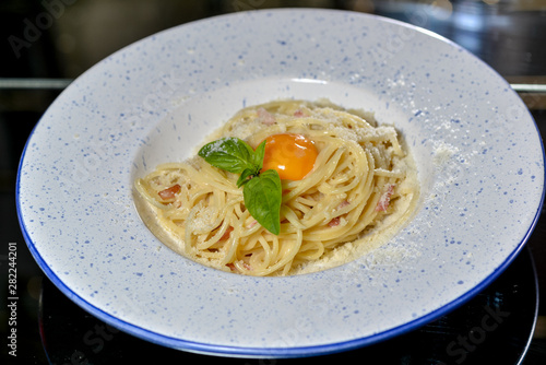 carbonara paste on a round plate with food styling