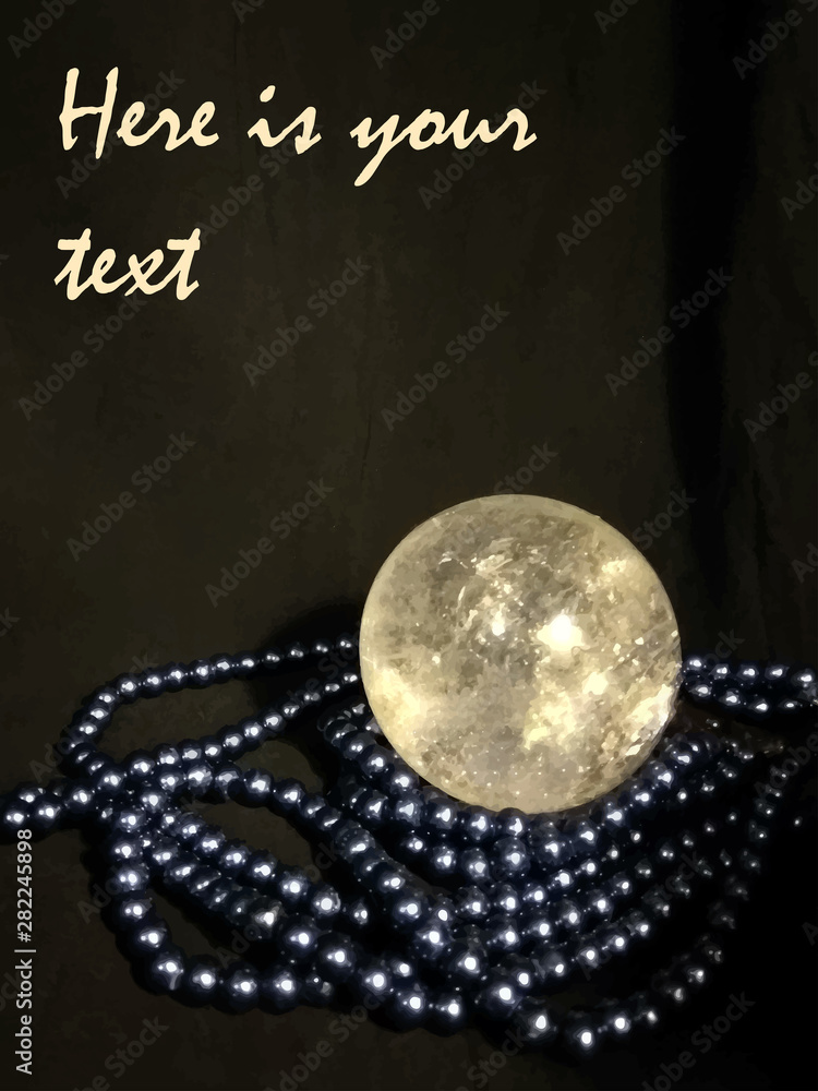 crystal ball and blue beads on a black background, fortune telling