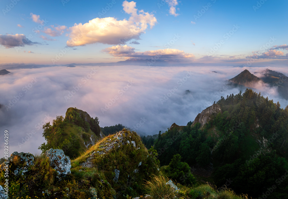 panorama of mountains and valleys covered with morning fog in the beautiful , spectacular sunrise from the top-Pieniny mountains, Three Crowns, Poland