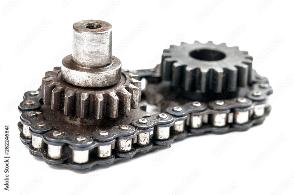 Driving roller chain and gear isolated on white background.Copy space Driving roller chain and gear isolated on white background.Copy space