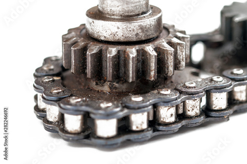 Driving roller chain and gear isolated on white background.Copy space