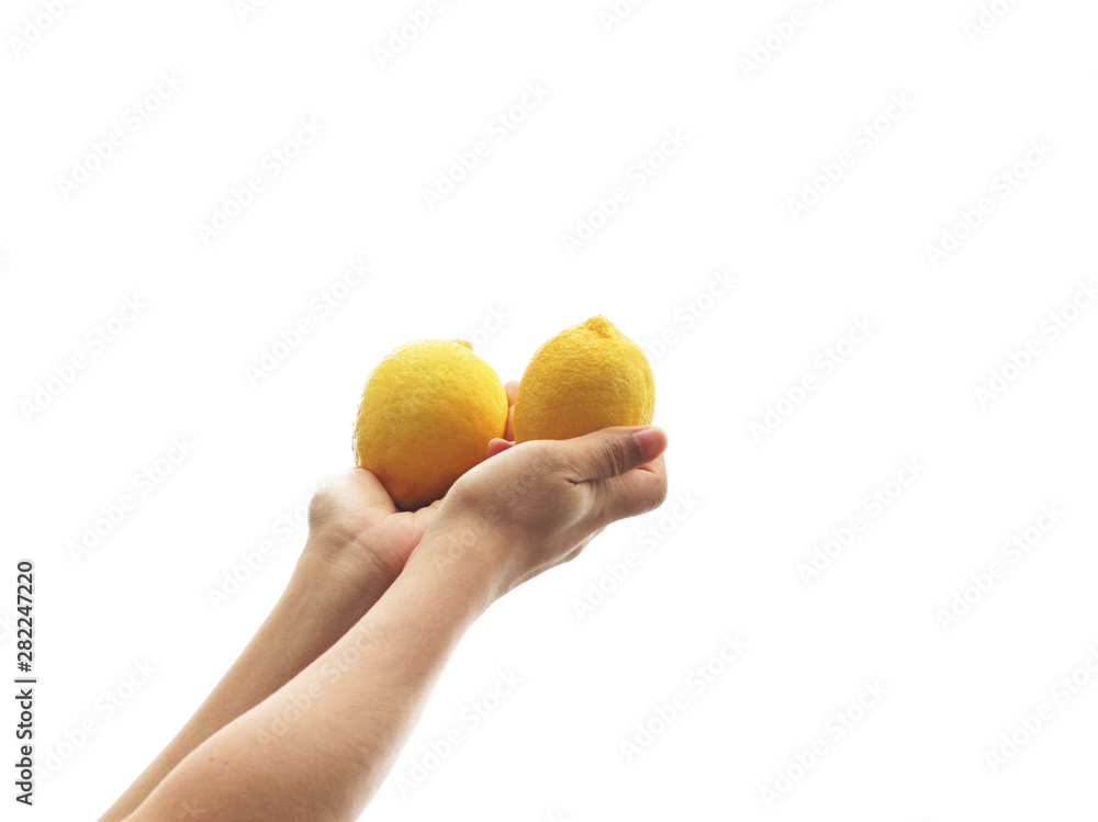 Women's hand of fresh lemon yellow on a white background. Women's hand of fresh lemon yellow on a white background.