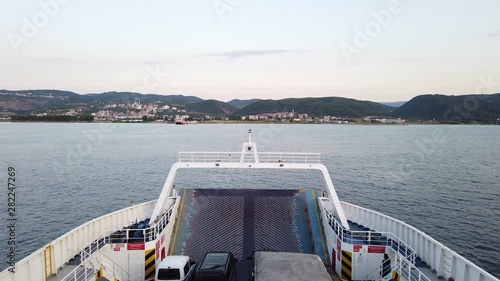 Yalova, Turkey - July 2019: Front deck of a ferry at sea carrying cars and trucks, heading to Yalova port on a summer afternoon