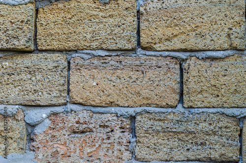 Shellstone wall with cement mortar. Shooting at eye level. photo