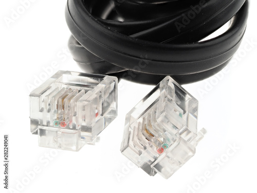 Black telephone cable with RJ11 connectors, isolated on white photo