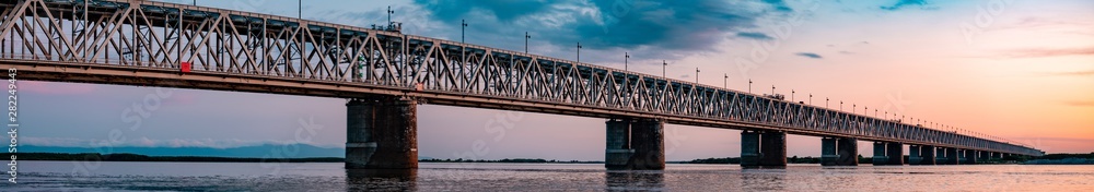 Bridge over the Amur river at sunset. Russia. Khabarovsk. Photo from the middle of the river.