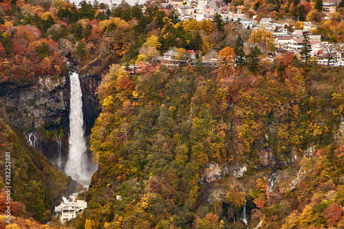 View of vibrant autumn colors (foliage) at Chuzenji lake Mt. Nantai and Kegon falls, Nikko,  Kanto Prefecture, Japan photo