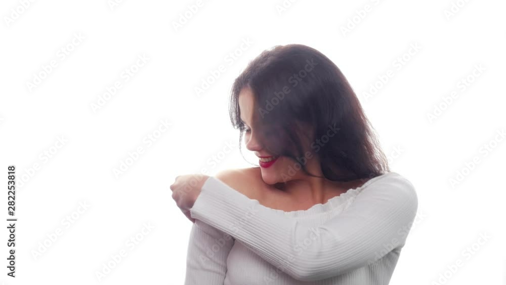 Beautiful sweet girl straightens her clothes - White Background - Face Expressions Beautiful sweet girl straightens her clothes - White Background - Face Expressions
