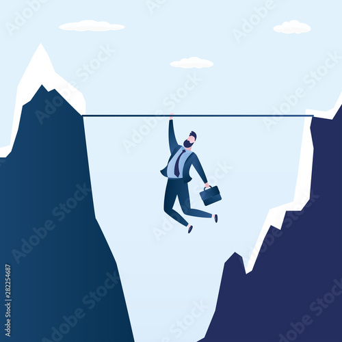 Businessman hanging over a cliff,business problem or crisis concept