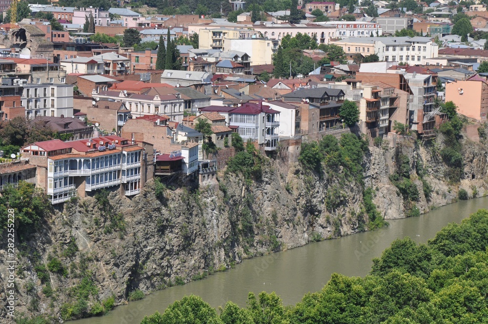 Houses of the old district of Tbilisi, standing on the steep bank of the Kura River