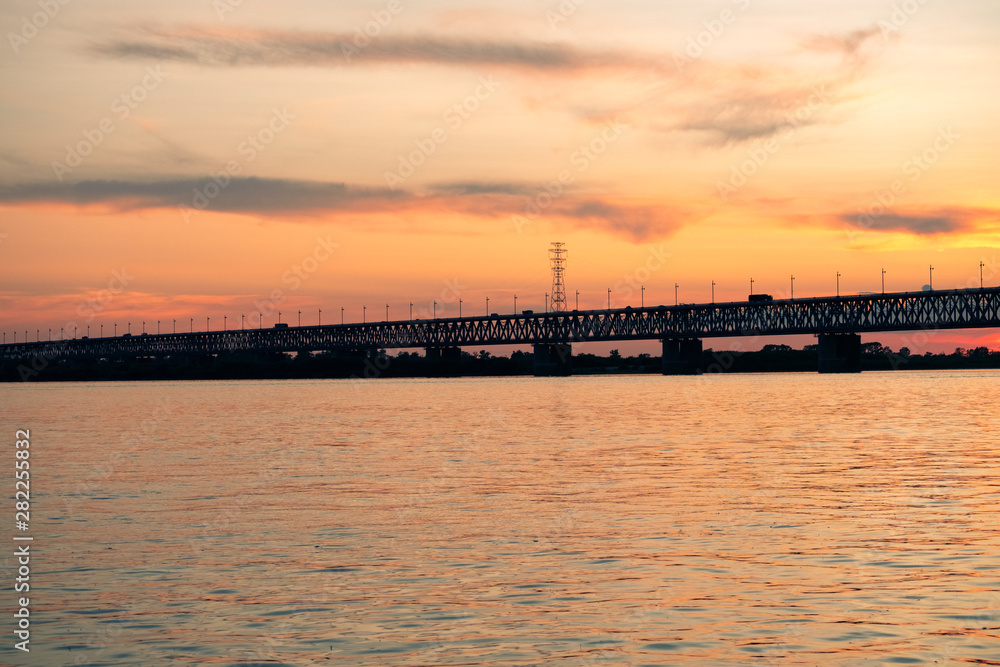 Bridge over the Amur river at sunset. Russia. Khabarovsk. Photo from the middle of the river.