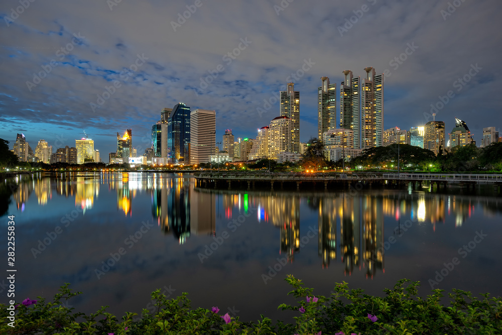 Fototapeta premium Night cityscape at Benchakitti Park in Bangkok, Thailand