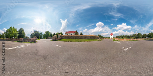 Fototapeta Naklejka Na Ścianę i Meble -   full seamless spherical hdri panorama 360 degrees angle view on parking near stone fence  small catholic church in equirectangular projection, ready AR VR content