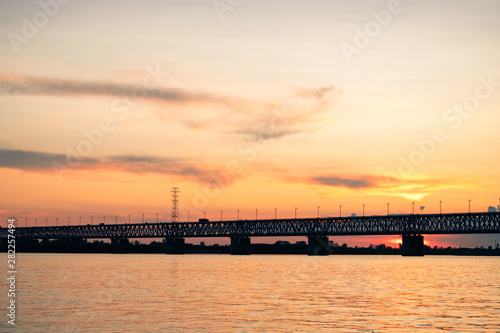 Bridge over the Amur river at sunset. Russia. Khabarovsk. Photo from the middle of the river.