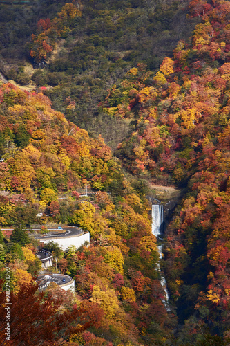 View of vibrant autumn colors (foliage) at Chuzenji lake Mt. Nantai waterfall and 1st Irohazaka, Nikko,  Kanto Prefecture, Japan photo