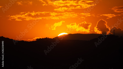 Colorful orange sunset over mountains