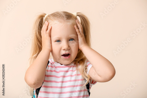 Stressed little schoolgirl ...