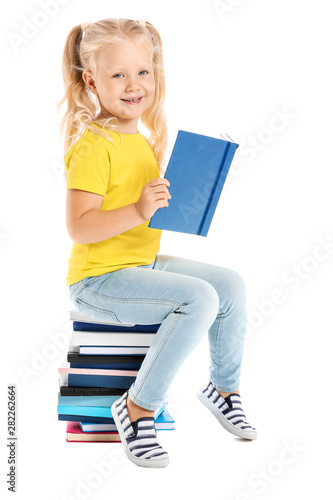 Cute little girl sitting on...