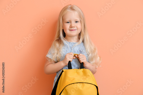Cute little schoolgirl with...