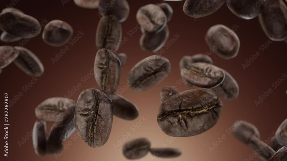 Falling coffee grains on a brown background Falling coffee grains on a brown background