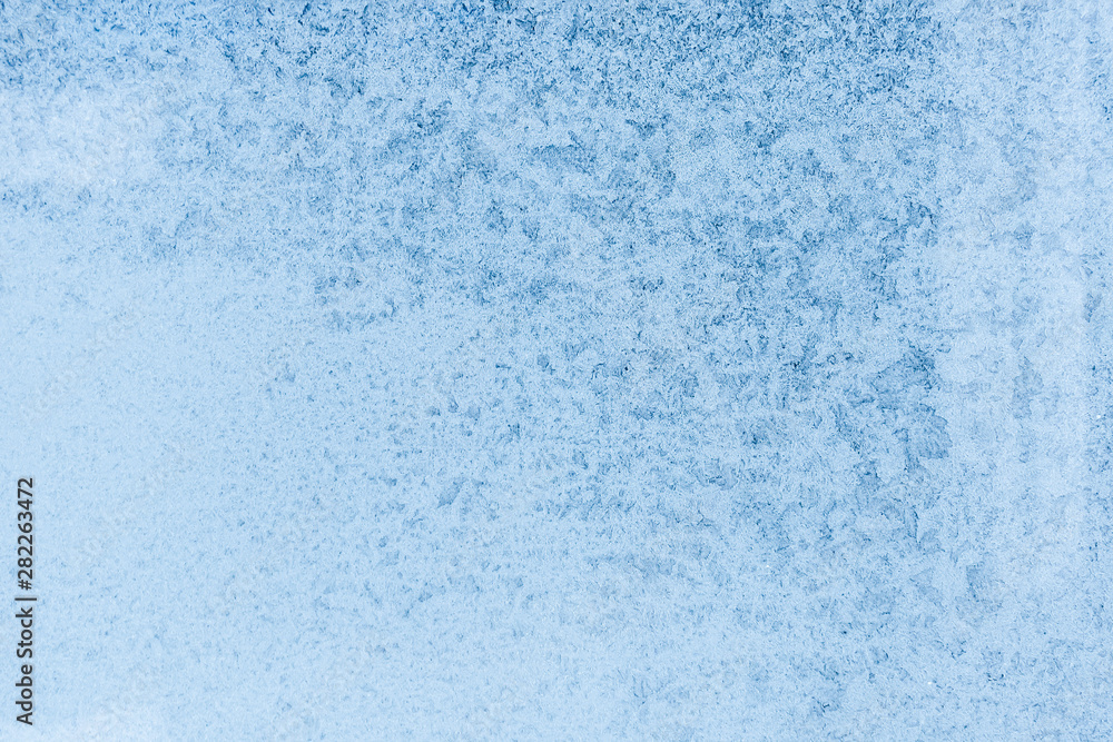 The pattern on the window. Background of frozen glass. Frosty window texture. The pattern on the window. Background of frozen glass. Frosty window texture.