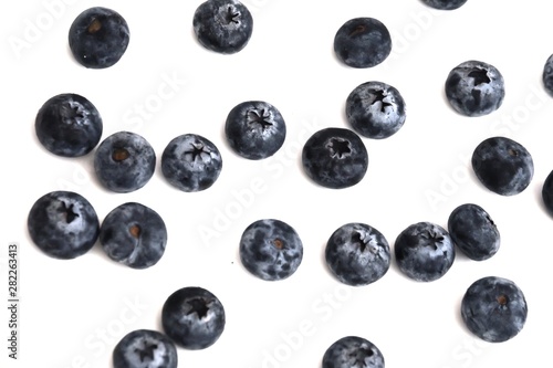 Blurred a pile of fresh blueberries on white isolated background