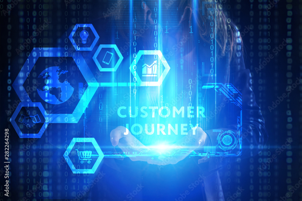 The concept of business, technology, the Internet and the network. A young entrepreneur working on a virtual screen of the future and sees the inscription: Customer journey The concept of business, technology, the Internet and the network. A young entrepreneur working on a virtual screen of the future and sees the inscription: Customer journey