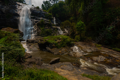 Wachirathan waterfall surrounded by lush tropical forest in Doi Inthanon National Park near Chiang Mai