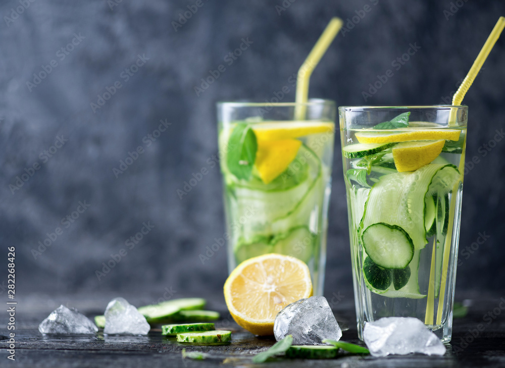 Fototapeta premium Summer cucumber lemonade with lemon and mint. Cold drink lemonade