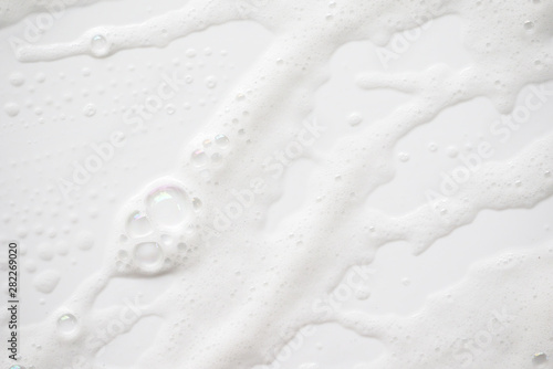 Abstract background white soapy foam texture. Shampoo foam with bubbles