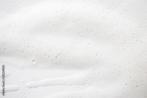 Abstract background white soapy foam texture. Shampoo foam with bubbles