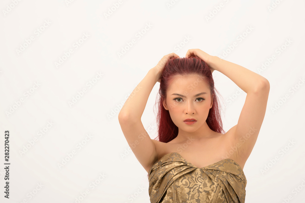 Beautiful young Asain fashionable Woman pull up hairstyle on isolated background Beautiful young Asain fashionable Woman pull up hairstyle on isolated background