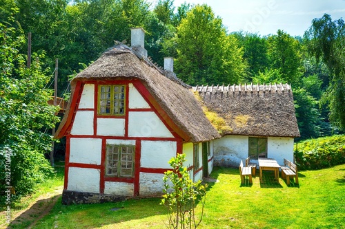 Beautiful old rustic thatched roof house. Denmark. Architecture. photo