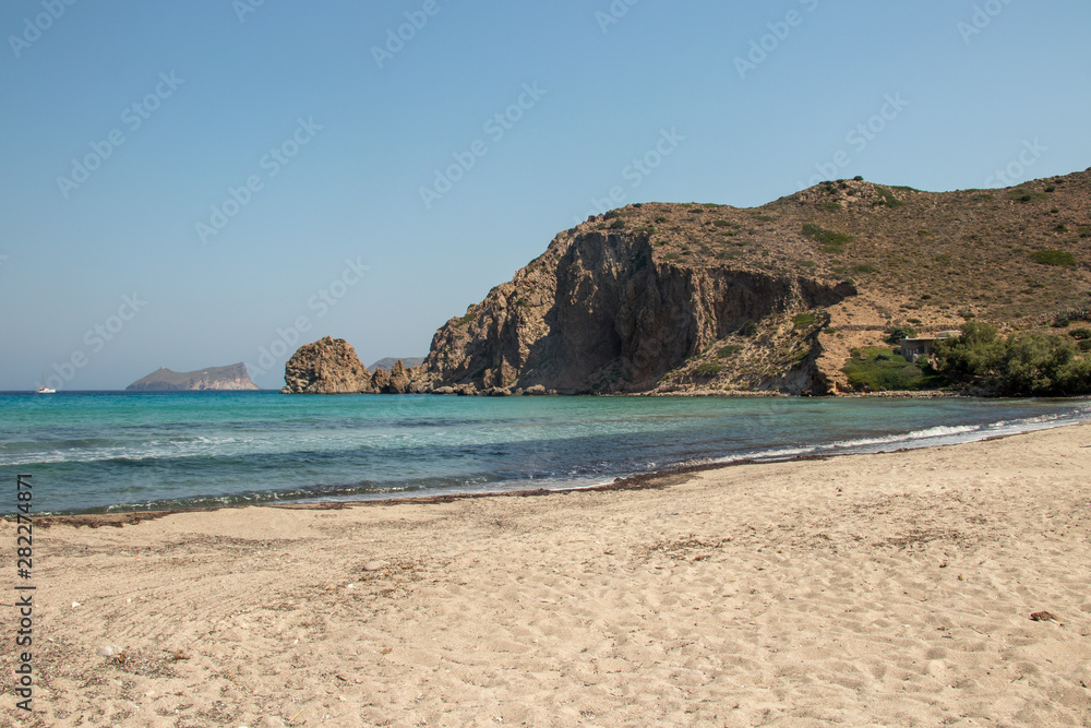 beach with rocky landscape on Milos island