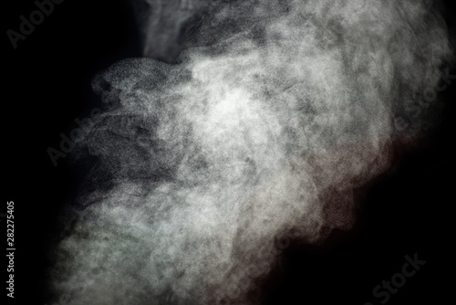Light flow of smoke on a black background