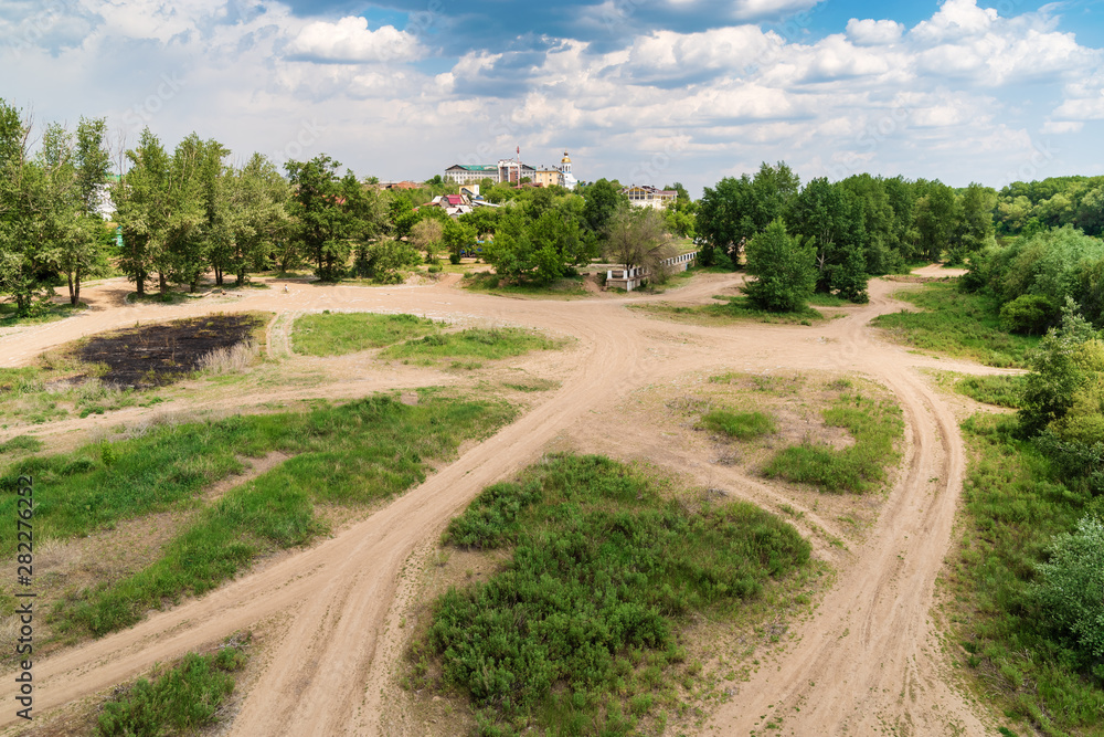 Orenburg, Russia - June, 1, 2019: Urban wasteland on the banks of the Ural River. Summer city landscape Orenburg, Russia - June, 1, 2019: Urban wasteland on the banks of the Ural River. Summer city landscape