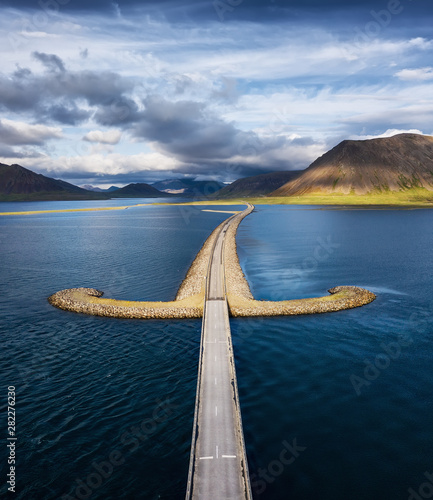 Iceland. Aerial view on the mountain and road. Landscape in the Iceland at the day time. Famous place in Iceland. Landscape from drone. Travel - image